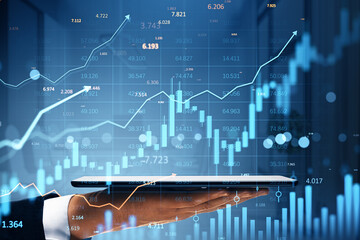 Poster - Businessman hand holding tablet with digital financial stock market data, candlestick chart and upward graph overlay on abstract blue background.