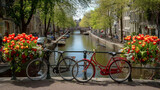 Amsterdam canals with bicycles and tulips