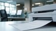 © KimMi - A printer whirring as a sheet of paper is inserted for a final draft of a document in an office setting