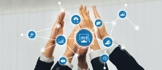 Poster - A group of diverse business professionals joins hands together, representing collaboration in analytics and strategy, emphasized by digital chart graphics and modern office aesthetics. Amity