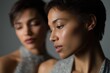 © Andrii Zastrozhnov - Two young asian females in elegant attire with soft focus and dramatic lighting