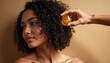 © Vadym - Woman applies nourishing oil to curly hair with dropper for healthy shine, hydration. Self-care ritual, using textured hair serum, promotes curl definition, frizz control. Focus on natural beauty,