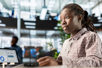 Poster - African american manager analyzing company data for strategic planning, solving resource allocation and effective business operations. Expert does financial forecasting and data analysis.