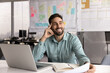 © fizkes - Pensive professional man sits in workplace desk with laptop, organizer and papers, looking into distance with joyful expression, thinks creatively or brainstorming ideas feeling inspired and motivated