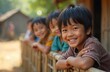 © Vadym - Portrait of smiling boy with dark hair, part of group of children in developing country. Hopeful expression suggests innocence, bright future amidst challenging circumstances. Image resonates with
