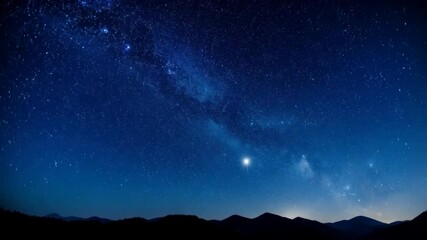Wall Mural - vivid milky way shines over silhouetted mountain range with bright star, creating a sense of cosmic 