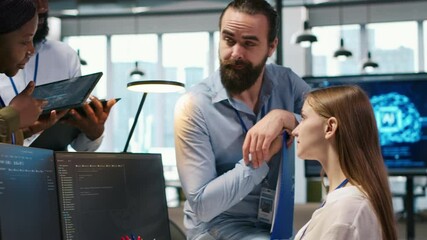 Fototapete - Startup newcomer making friends in office, learning how to use machine learning tech. Upbeat young girl in workplace chatting with coworkers while using AI predictive models, camera A