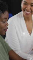 Poster - Animation of social media icons falling over two african american women discussing at office