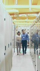 Poster - Animation of icons over diverse coworkers discussing while walking in corridor of data server room