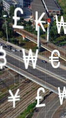 Poster - Animation of multiple currency symbols over aerial view of moving vehicles on roads in city