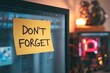 © sogap - Sticky Note Reminder on a Computer Monitor with the Words Dont Forget Written on it