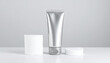 © NIKO - Silver Hand Cream Tube with Cotton Pads in a Clinical Yet Elegant Editorial Composition