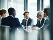 © Designer's Stockroom - Business men and women wearing suit or formal outfit, discussing at their meeting with co-worker and client at the office in modern building.
