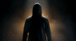 © PTC - Silhouette of a hooded figure illuminated by a spotlight, emphasizing mystery and anonymity.