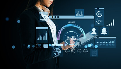 Poster - Businesswoman using digital tablet with financial risk management dashboard and data analytics interface on dark background for fintech analysis.