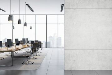 Poster - Modern empty office interior with row of desks and large blank concrete wall for poster or logo mockup in bright corporate workspace.. 3D Rendering