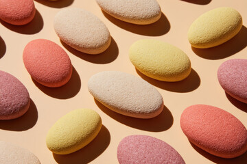Aufkleber - Colorful oval stone shapes arranged on pastel background, creating modern abstract health focused layout with calm and balanced mood, ideal for wellness or spa concepts
