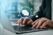 © Creativeraf - A person is typing on a laptop with communication and planning icons floating above the keyboard, representing digital connectivity