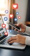 © MdKamal - Social media engagement concept laptop phone likes and hearts