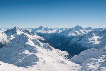 Wall Mural - vast landscape of snow-draped peaks under a clear blue sky