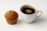 A single muffin paired with a cup of coffee