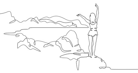 Fototapete - Continuous one line drawing  girl stands waving on a big rock on the seashore. Woman in short shorts on the seashore. Rocks and mountain by the sea. One continuous line isolated minimal illustration