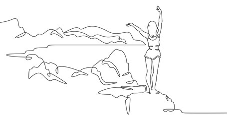 Fototapete - Continuous one line drawing  girl stands waving on a big rock on the seashore. Woman in short shorts on the seashore. Rocks and mountain by the sea. One continuous line isolated minimal illustration