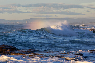 Wall Mural - Small wave on the ocean with splash.