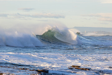 Wall Mural - Beautiful wave barrel with water splash.