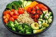 © azwan - Vibrant Healthy Vegan Buddha Bowl with Quinoa and Fresh Vegetables on Grey Background