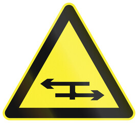 Fototapete - Warning road sign in China - T junction with a dual carriageway