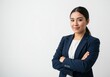 © Mdhittu - A confident asian businesswoman with crossed arms smiles gently against a white background, showcasing her professional demeanor