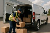 Delivery worker loading cardboard boxes into an electric van in an industrial area. Sustainable transportation and logistics concept Delivery worker loading cardboard boxes into an electric van in an industrial area. Sustainable transportation and logistics concept