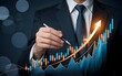 © MarufIslam - A businessman is using a pen to analyze a growth chart with an upward arrow, representing business success