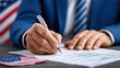 © Teeranan - Businessman Signing Official Document with American Flag Background