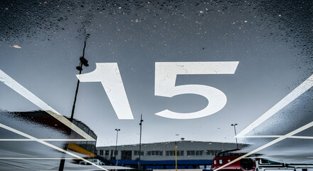 Poster - Abstract Reflection Of Number Fifteen In Puddle On Asphalt Parking Lot