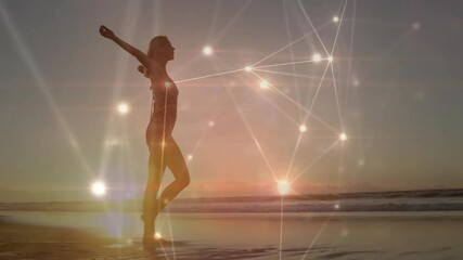 Poster - Sun rising initiating female silhouette walking shoreline while network pulsing showing technology