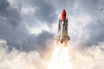 Wall Mural - modern space rocket in beautiful cloudy sky