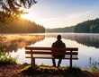 © Abdul Rahim - Man Sitting on Bench by Tranquil Lake at Sunrise