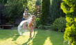 © ulza - Happy children brother and sister playing in the garden hose and having fun with spray of water in sunny backyard. Summer time.