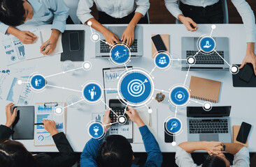 Poster - A modern office space showcasing collaboration and strategy, featuring professionals engaging with technology and data analysis tools for effective business growth. Amity