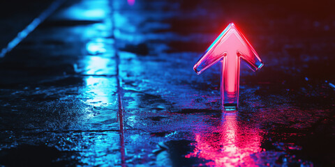 Poster - Neon arrow sign glowing on wet pavement at night with vibrant reflections.