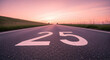 © RAFLY - Number Twenty Five On Asphalt Road At Sunset Symbolic Of Milestone Ahead