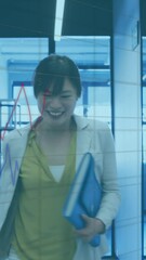 Poster - Animation of financial graphs and data over happy asian woman in office