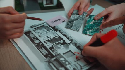 Poster - A vibrant collaboration moment showcasing hands selecting color swatches and reviewing architectural plans on a wooden table, perfect for innovative project development. SACTR