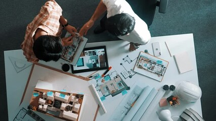 Poster - Top down view of skilled business man and colleague design house together. Aerial view of architect engineer working and measuring building structure by using architectural equipment. Alimentation.