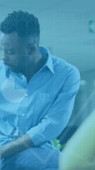 Poster - Animation of data processing over diverse man and woman discussing over a laptop at office