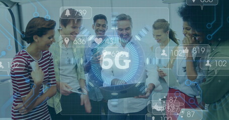 Poster - Gathering coworkers around laptop discussing in office area, with 5G icons, phone and coffee mug