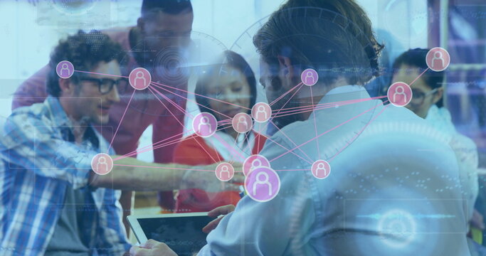 Man in blue shirt holding tablet at office table, with holographic network diagrams, copy space