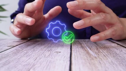 Poster - Close-up of a woman's hands protecting a virtual icon of a gear with a check mark